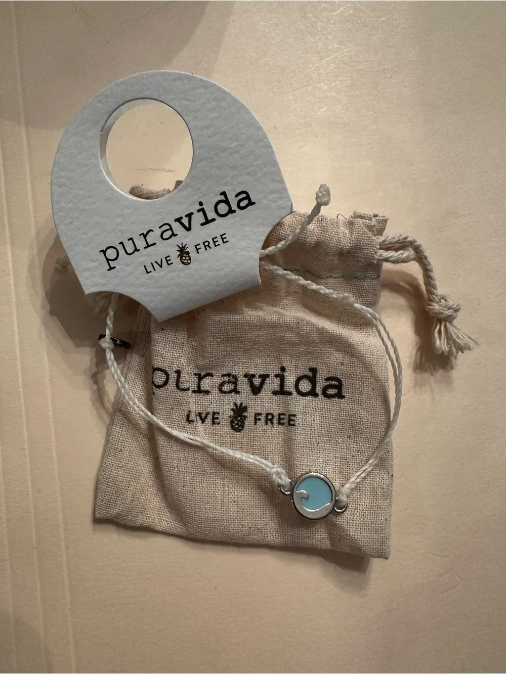 Pura Vida Light Blue Wave Charm Bracelet - White Cord